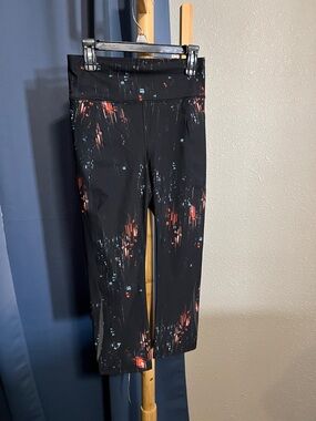 Sweaty Betty Black Capri Leggings with Red & Blue Abstract Print